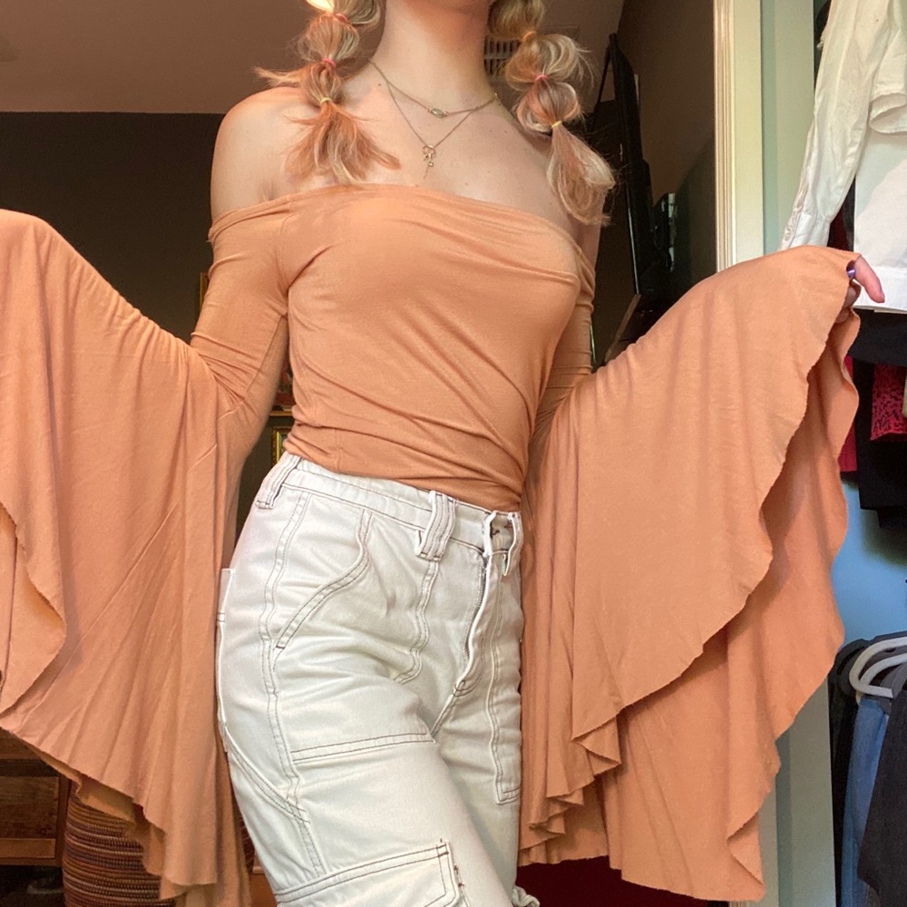 Orange Free People top with ICONIC flowy sleeves